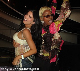 She held a big smile on her face as she paused for more snaps with a friend at the event