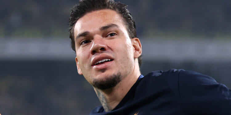 Ex-Man City star Ederson falls to floor after being hit by missile... before lashing out as camera gets too close to him