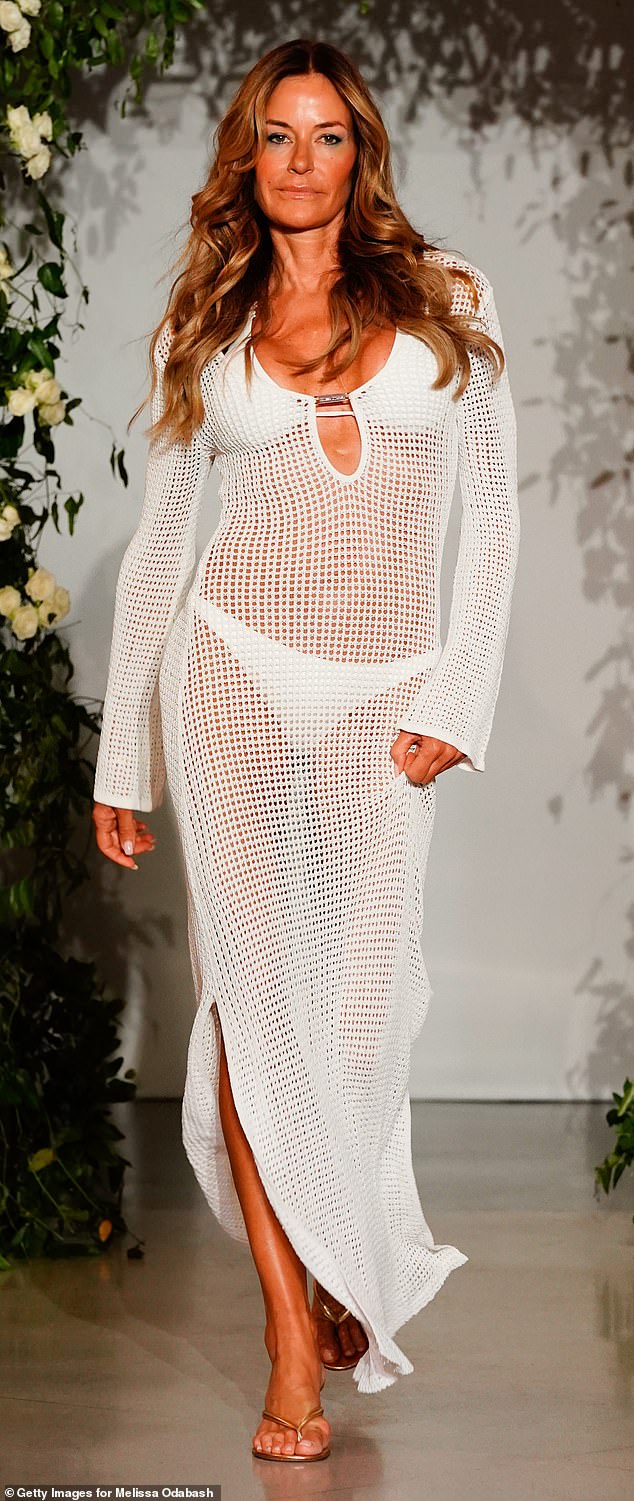 Kelly walks the runway at the Melissa Odabash Show during Miami Swim Week