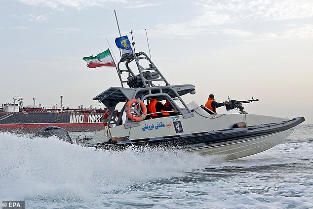An Iranian Revolutionary Guard jet boat sails around a seized tanker in Bandar Abbas, southern Iran, July 2019 (reissued August 2019)