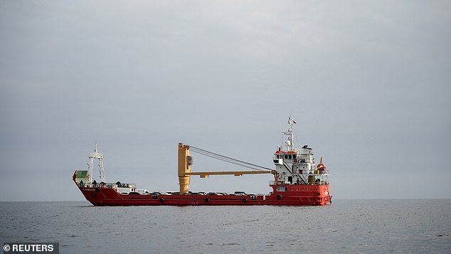 A vessel at the Strait of Hormuz, off the coast of Oman's Musandam province, April 12, 2026
