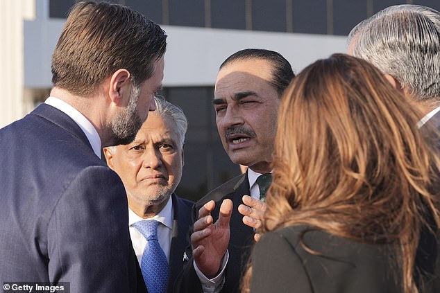Vice President JD Vance, left, talks to Pakistan's Chief of Defence Forces and Chief of Army Staff Field Marshall Asim Munir, right, and Pakistani Deputy Prime Minister and Foreign Minister Mohammad Ishaq Dar, center, before boarding Air Force Two after attending talks on Iran on April 12, 2026 in Islamabad, Pakistan