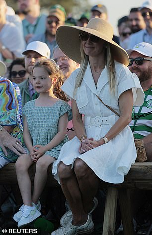 McIlroy's family watches on as he sinks the last putt