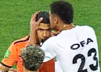 Moment referee gives footballer death stare after he bizarrely KISSES him on the head