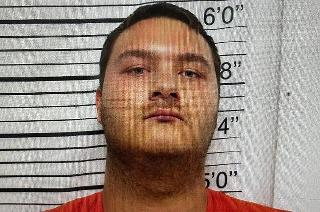 Hawkins, 20, was armed with two semi-automatic handguns when he walked into the lobby of the school