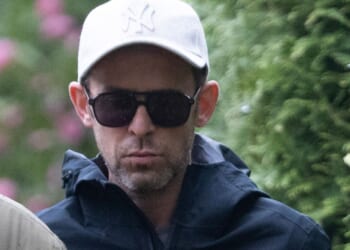 Downcast Scott Mills seen for 1st time since being sacked by BBC 'over teen boy sex probe' as he walks dog with husband