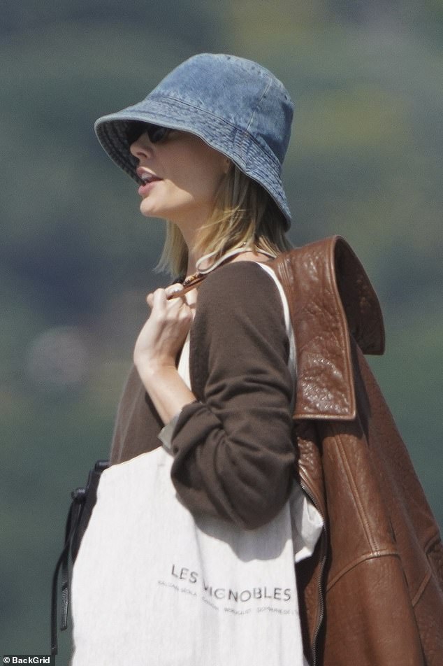 Margot carried a series of layers ahead of the beach day