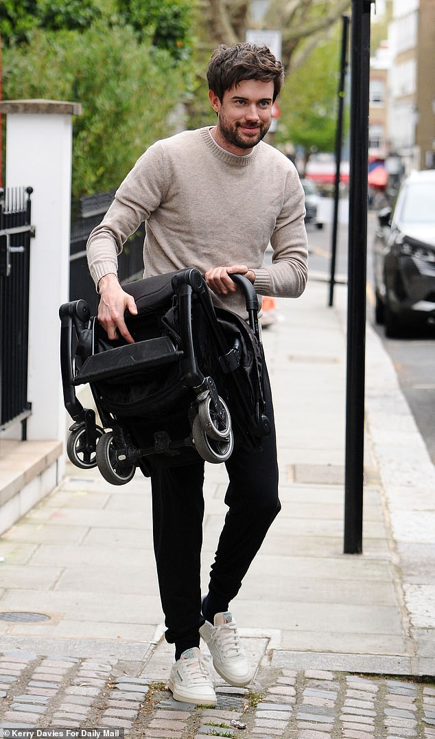Jack, cutting a casual figure in a beige jumper and black jeans, looked full of nervous excitement as he helped load suitcases into the taxi