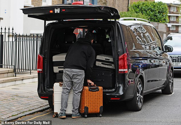 Roxy certainly didn't pack light as suitcases were loaded into the back of the taxi ready for the celebrations