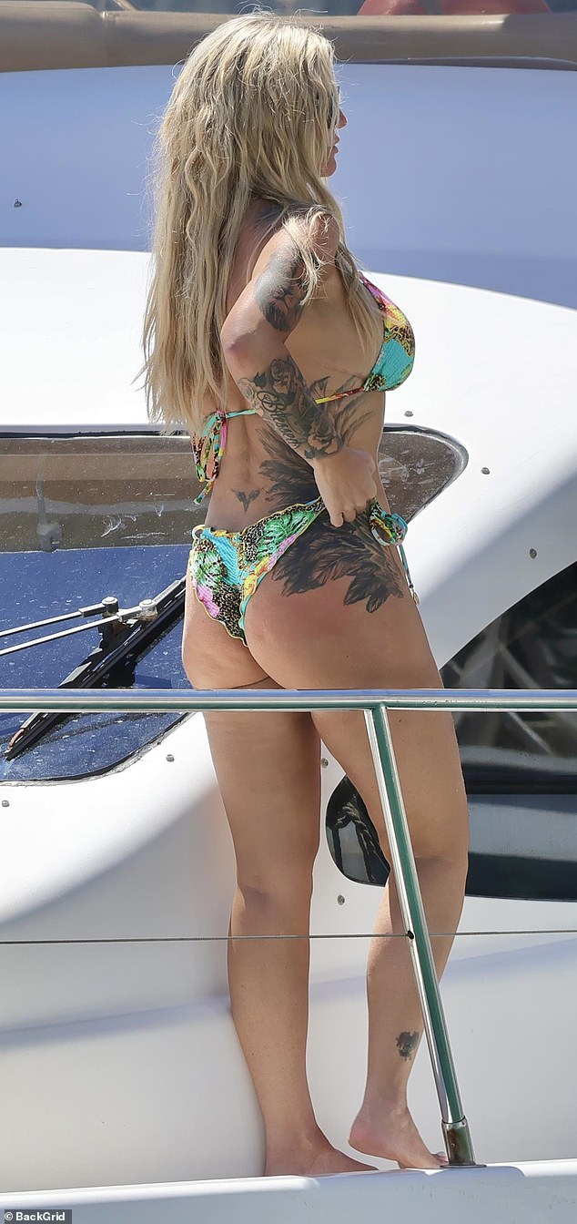 The mother-of-five sizzled in the vibrant two piece which left little to the imagination