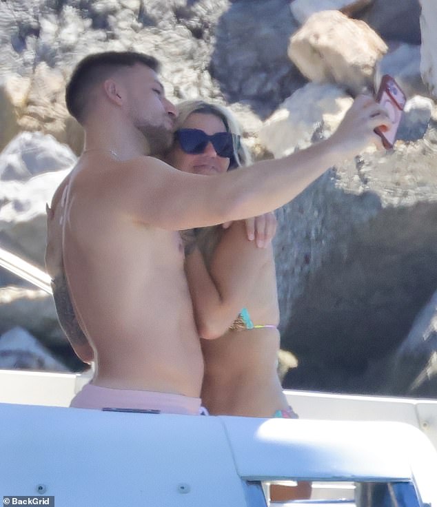 The lovebirds looked happier than ever as they cosied up for a snap