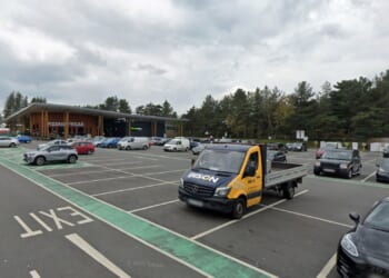 Man killed & woman injured after being hit by car which crashed into parked vehicles at major motorway service station