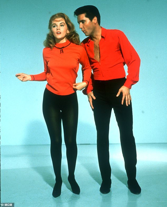 She wore a vibrant red sweater as well as a pair of black tights - similar to the look Ann-Margaret had donned in the movie