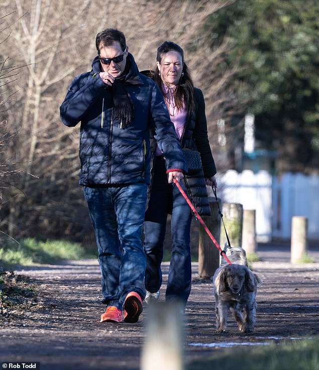 Ms Freemantle with husband Domini'c a former executive at Morgan Stanley who now works for a firm called Lincoln Private Investment Office, walking their dogs around Wimbledon Park