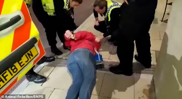 Smart is an inveterate environmental campaigner who has been arrested for protest activities before ¿ including for confronting naturalist and broadcaster Sir David Attenborough, again at the Catch restaurant, in 2022. Pictured: Her arrest after the incident