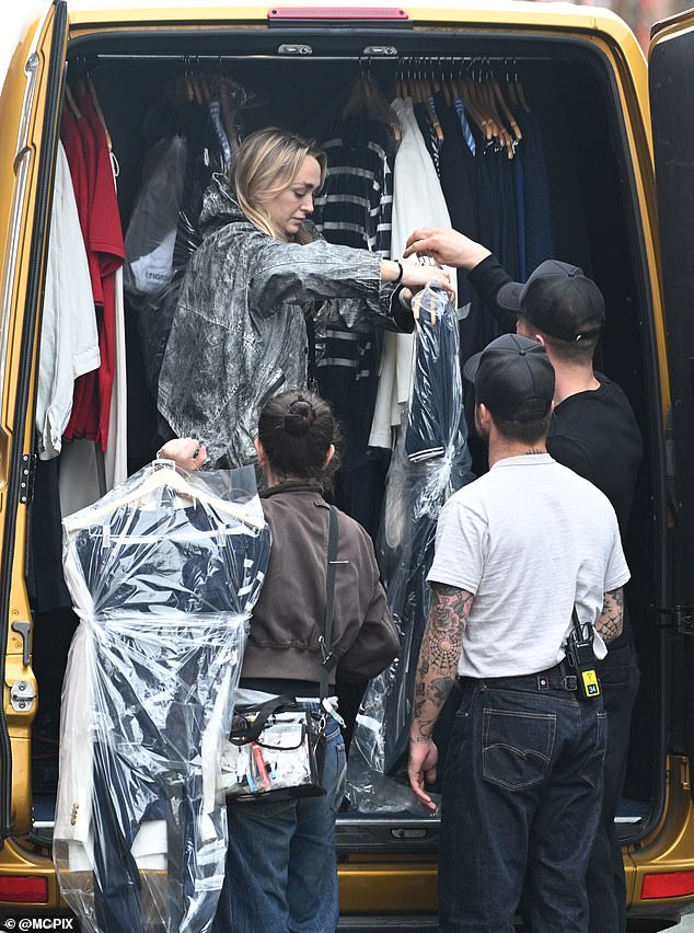 crew members seen with a van full of outfits