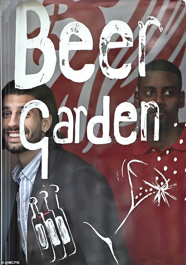 Early pictures showed the footballer's with beer garden graphics