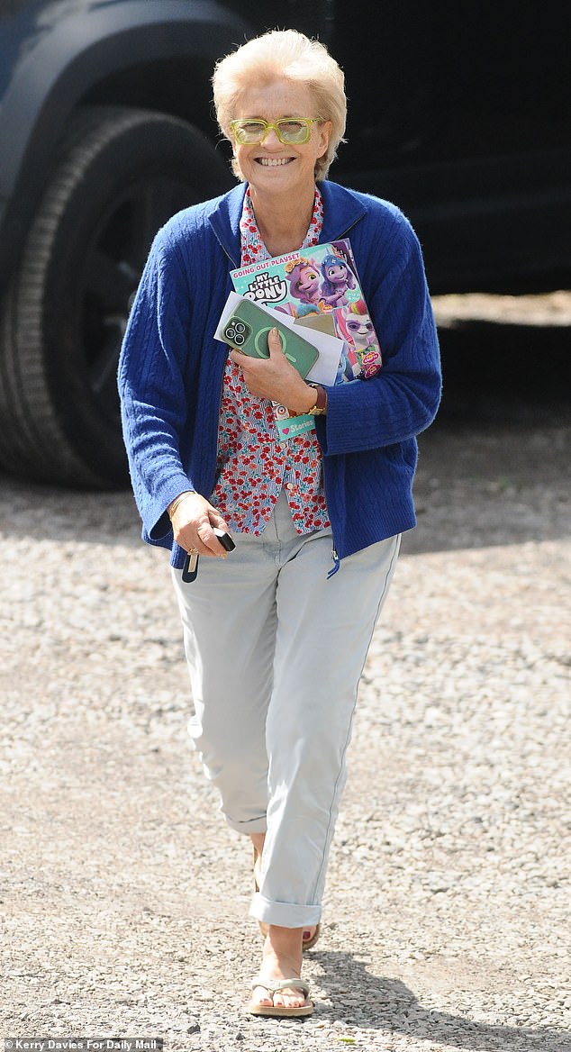 Jack Whitehall's mother Hilary, 64, arrived at the venue in her daughter Molly's Land Rover Defender, wearing a floral blouse and mumsy blue cardigan and clutching a My Little Pony magazine for one of her granddaughters – and eye revival patches under her reading glasses