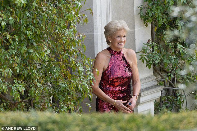 While she was dressed casually arriving, Hilary looked incredible as she later emerged in a red sequined halterneck dress befitting the glamorous black-tie 'fizz and frolics' theme