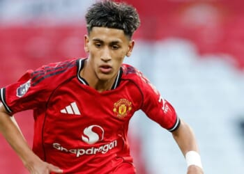 Moment footie fan holds lifelike toy gun while patting teen Man Utd ace JJ Gabriel, 15, on the arm