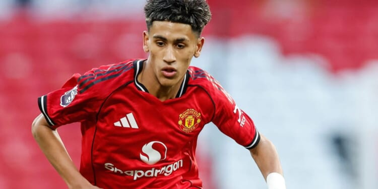 Moment footie fan holds lifelike toy gun while patting teen Man Utd ace JJ Gabriel, 15, on the arm