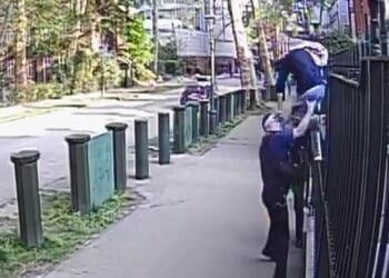 Moment migrant is tackled by armed cops after 'trying to jump fence of Israeli embassy & carry out knife terror attack'