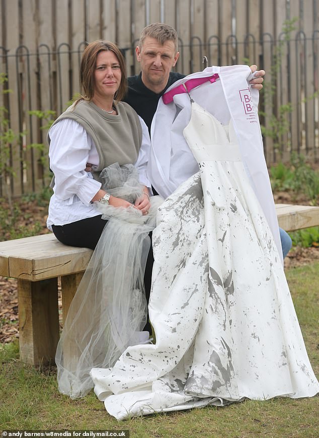Gemma was so determined to marry childhood sweetheart Ken Monk, pictured with the paint splattered dress, that she spent two hours cleaning herself up and had the wedding anyway
