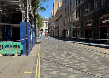 Car ploughs into pedestrians on city centre street leaving three injured as woman, 29, arrested for 'attempted murder
