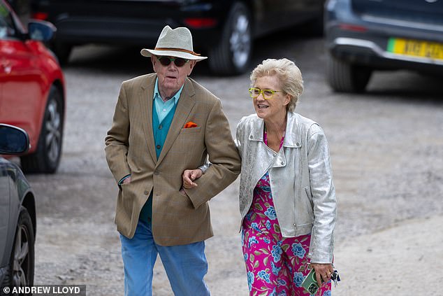 Hilary looked lovely in a floral print dress after wowing onlookers with her glitzy red sequinned halterneck dress during the £250,000 ceremony