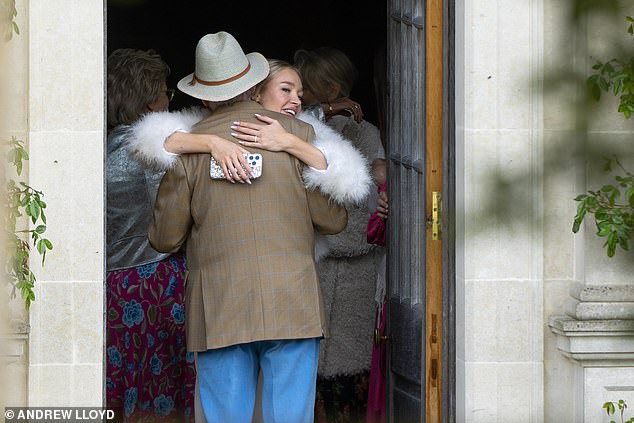 Theatre agent Michael was looking dapper in a trilby hat and brown jacket for the Sunday gathering