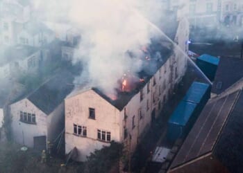 Historic Antrim hotel gutted in huge blaze as over 40 firefighters rush to battle fire with 'avoid area' warning issued