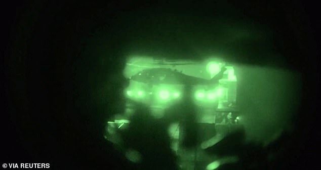 A helicopter carries U.S. Marines from the amphibious assault ship USS Tripoli at an unknown location, in what the U.S. Central Command (CENTCOM) says is an operation to board and seize Iranian-flagged cargo ship M/V Touska, in this screen grab taken from a handout video released on April 20, 2026. U.S. Central Command via X/Handout via REUTERS    THIS IMAGE HAS BEEN SUPPLIED BY A THIRD PARTY. MANDATORY CREDIT  VERIFICATION:                                     - Location and date could not be verified - No older version of the video was found posted before April 20