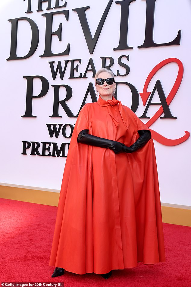 She accessorized with black gloves and sunglasses
