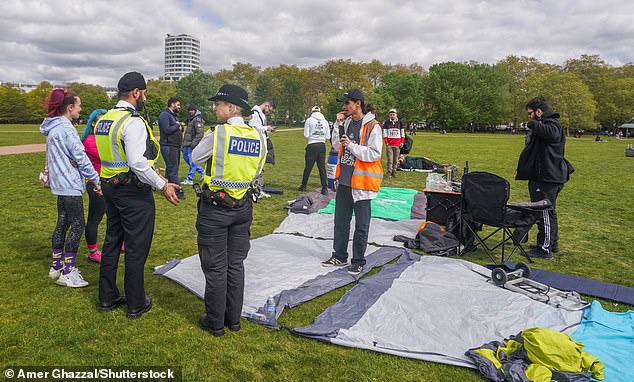 Police were pictured standing nearby as cannabis fans pitched up for the event