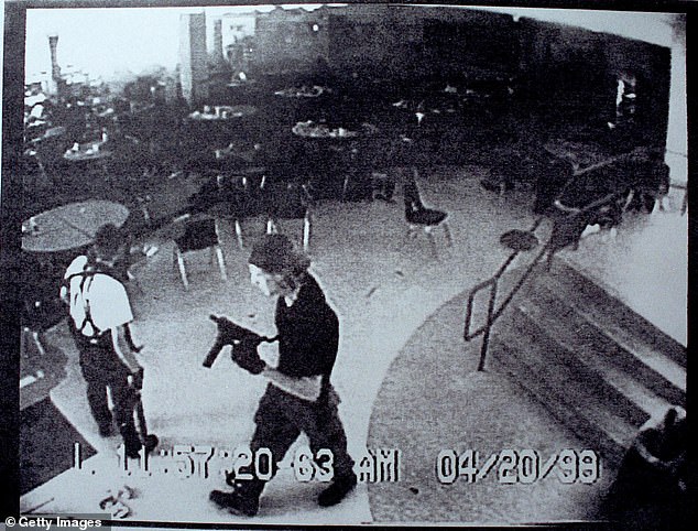 The gunman who opened fire on tourists visiting a Mexican archaelogical site is said to have idolised the two students behind the 1999 Columbine High School massacre, it has emerged. Pictured: Columbine high school shooters Eric Harris (L) and Dylan Klebold appear in this video capture of a surveillance tape released by the Jefferson County Sheriff's Department in the cafeteria at Columbine High School April 20, 1999 in Littleton, CO during their shooting spree which killed 13 people