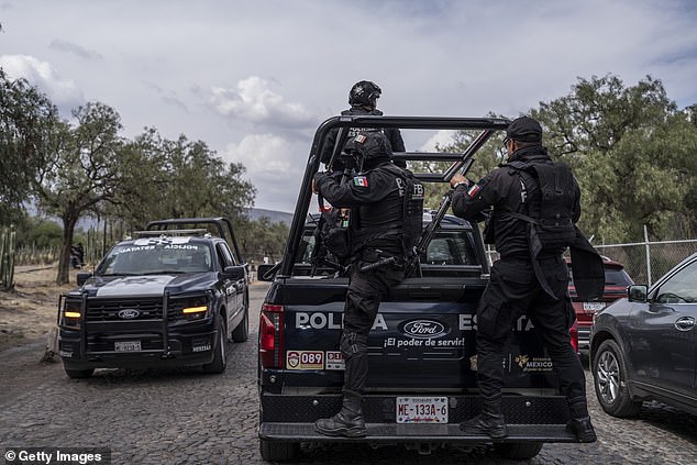 The gunman started shooting from above a pyramid, killing one Canadian tourist. Pictured: Mexica police arrive at the scene of the shooting