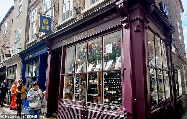 Paul Dawson Coins on The Shambles in York is pictured. In the Harry Potter books, Diagon Alley is a Dickensian cobbled street full of shops for wizards and students