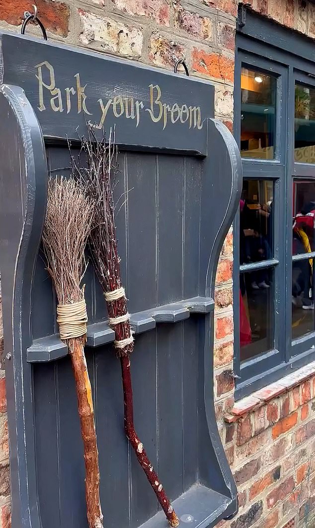 A sign beside one Harry Potter store reads: 'Park your broom'. Despite the views of some locals, many traders of The Shambles have rallied around its attractions