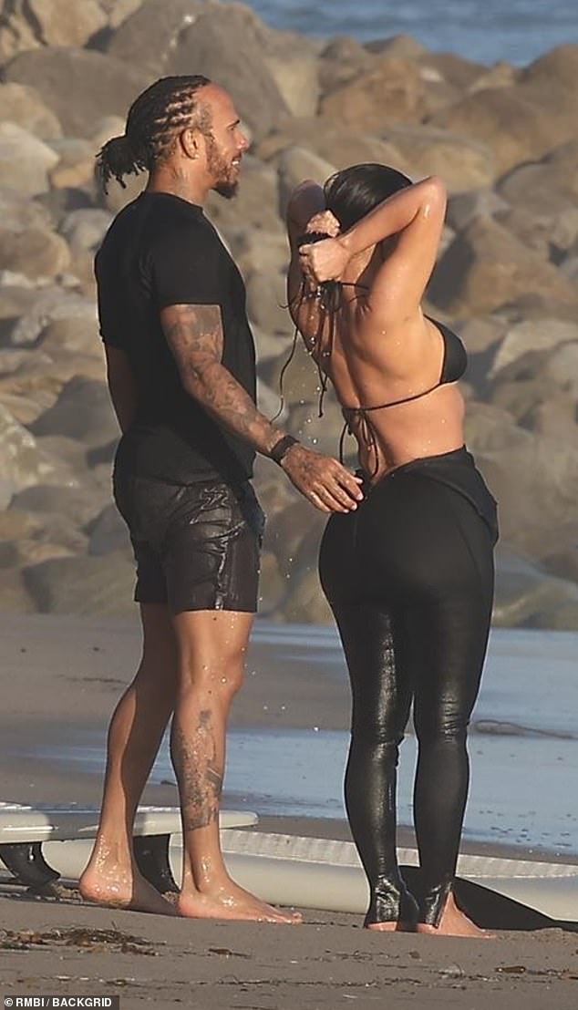 She wore a bikini top and a wet suit that was pulled down