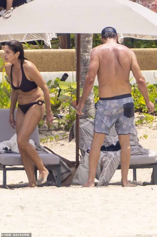 The lovebirds emerged from the water to relax near lounge chairs