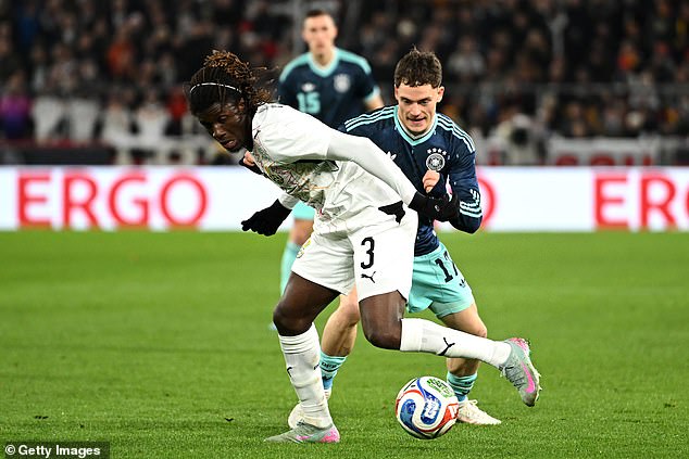 Caleb Yirenkyi battles Germany and Liverpool's Florian Wirtz in a friendly last month
