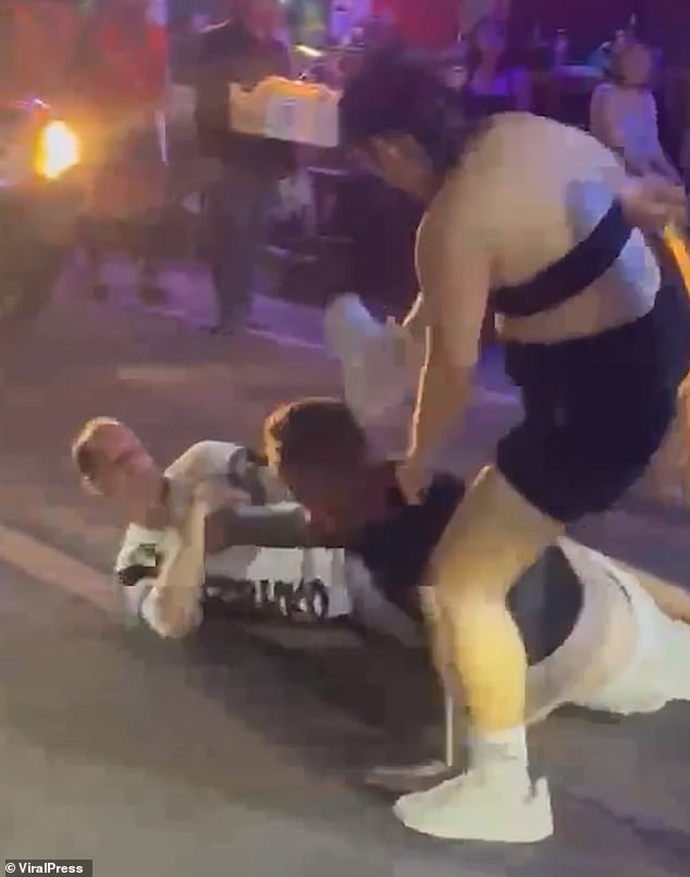 Footage shows the intoxicated Brits kicking and pummelling the German