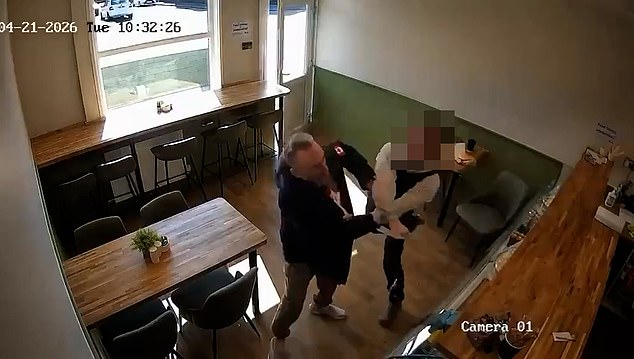 The customer then throws a number of punches at the knifeman, who appears dazed as he stumbles back towards the counter