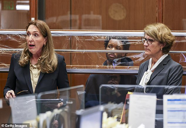 Burke looks on as his defense attorneys Blair Berk (left) and Marilyn Bednarski (right) speak during his arraignment for the murder of Celeste Rivas Hernandez at Clara Shortridge Foltz Criminal Justice Center on April 20, 2026 in Los Angeles