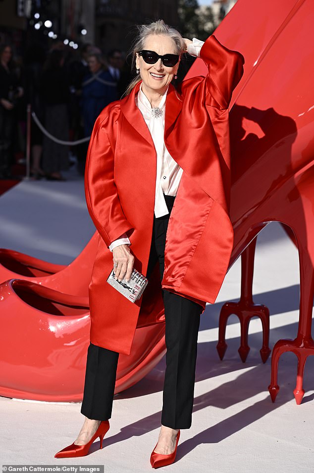 Meryl, 76, opted for a smart red jacket and white shirt