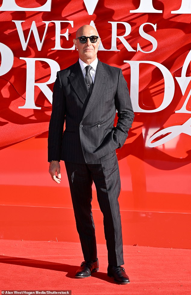 Stanley, 65, wore a dapper suit from Paul Smith