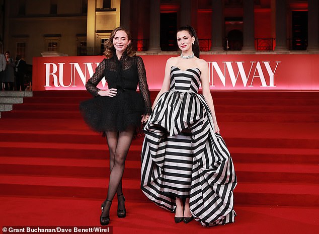 The actress put on a very leggy display in the long sleeved ensemble and added inches to her frame in a pair of towering heels