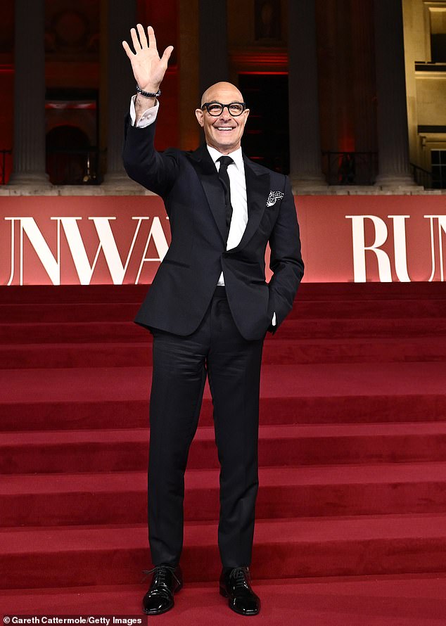 Meanwhile Stanley ditched his dapper black pinstriped suit for a smart navy blazer and trousers complete with a black tie