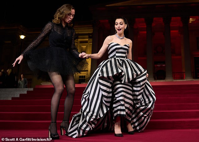Anne was stotted helping Emily down the stairs in her towering platform heels