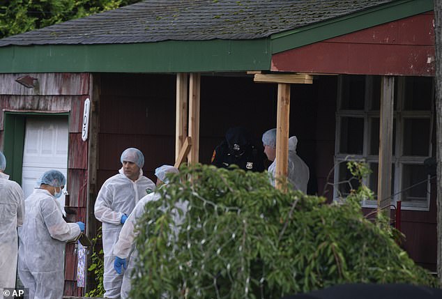 Law enforcement on the scene of Rex Heuermann's home following his arrest in July 2023